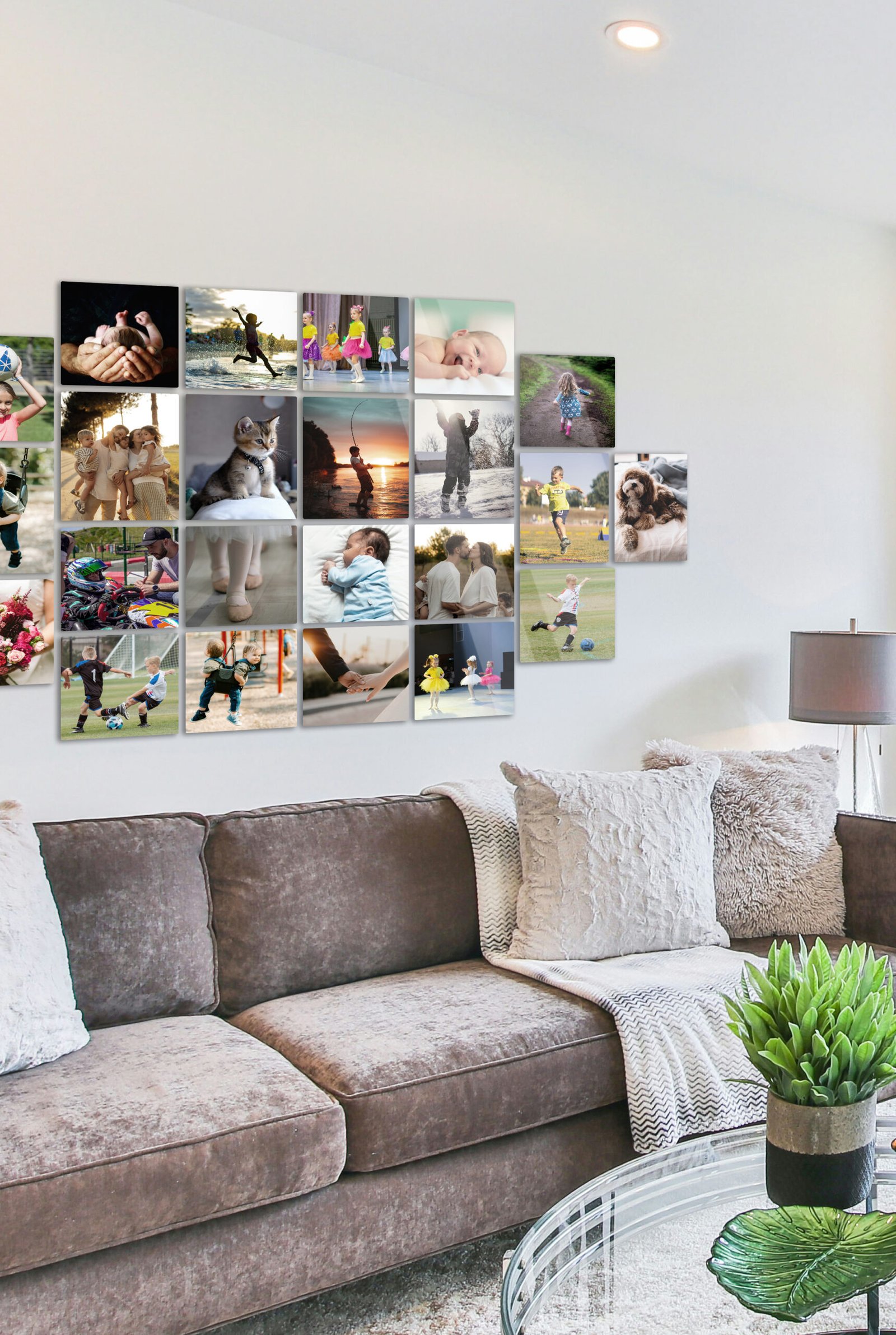 A modern living room couch mockup featuring a large multi-size custom family photo wall gallery made of mixed 15x15, 15x18.75, 14x18, and 12x18 glossy metal prints.
