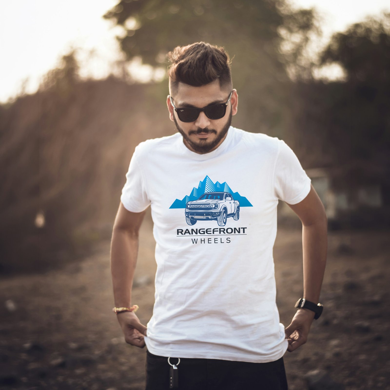 Man wearing custom Rangefront Wheels t-shirt in outdoor promotional photography