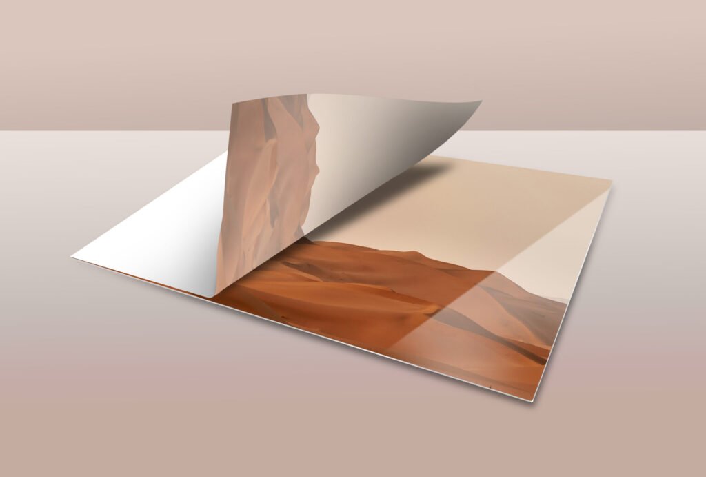 3D diagram showing a sublimation transfer paper peeling back from a glossy ChromaLuxe metal panel to reveal a printed landscape photo